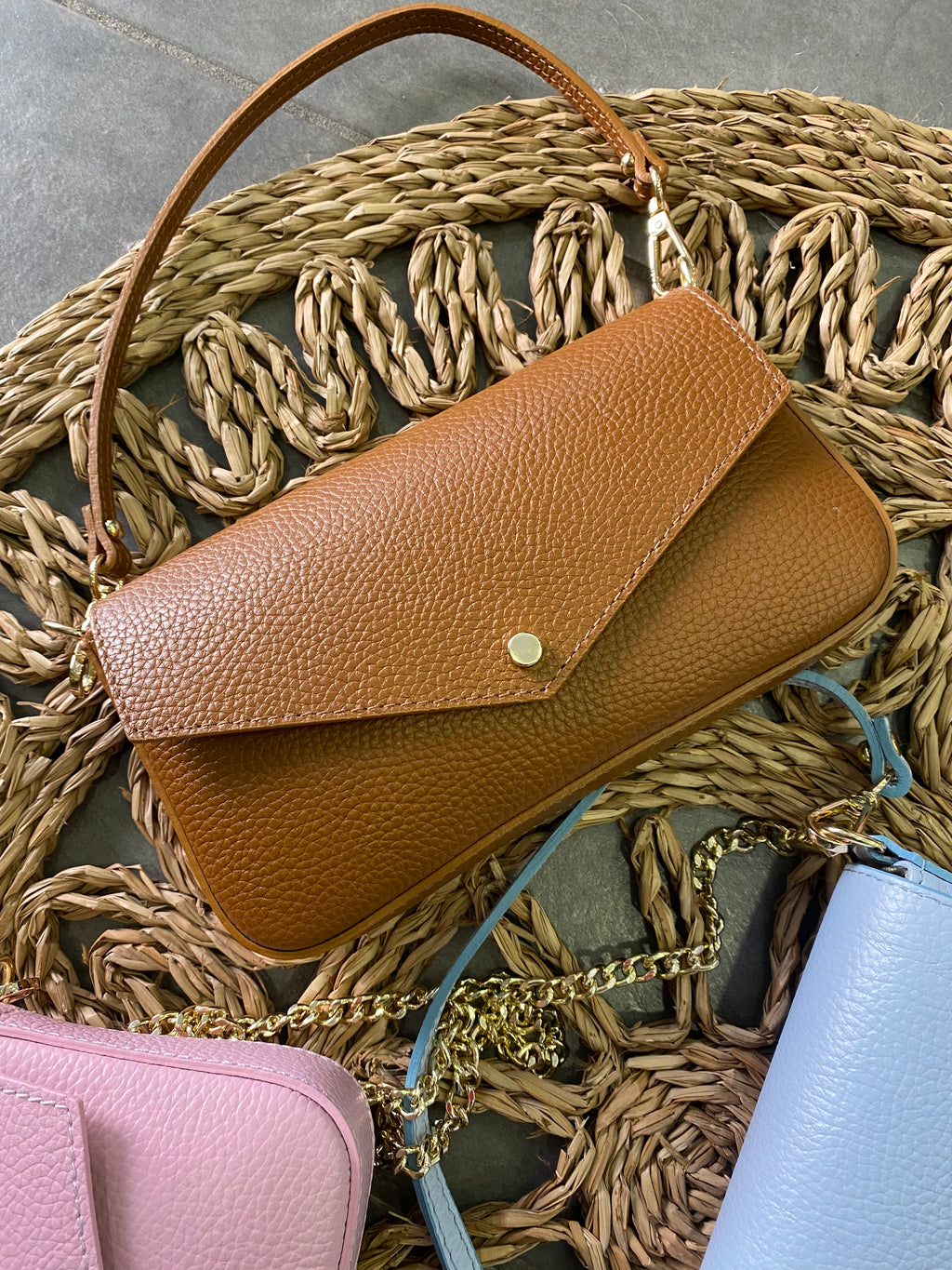 Pochette a busta in pelle