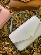 Pochette a busta in pelle